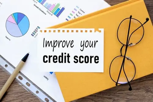 Improve Your Credit Score. text on the page on a yellow notepad.