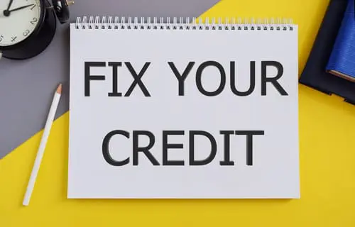 Fix Your Credit text written in Notebook.