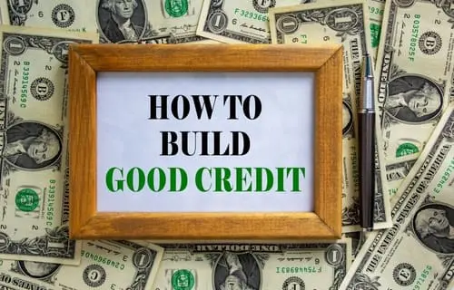 Wooden picture frame with words 'How to build good credit'