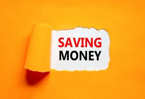 Saving money symbol. Concept words Saving money on beautiful white paper on a beautiful orange background.