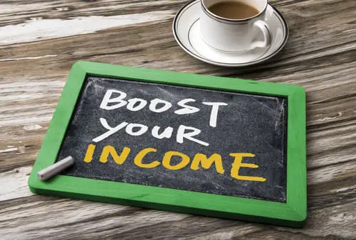 Boost your income handwritten on blackboard