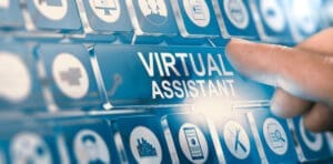 Finger pressing a digital button with the text virtual assistant.