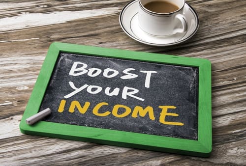 Boost your income handwritten on blackboard