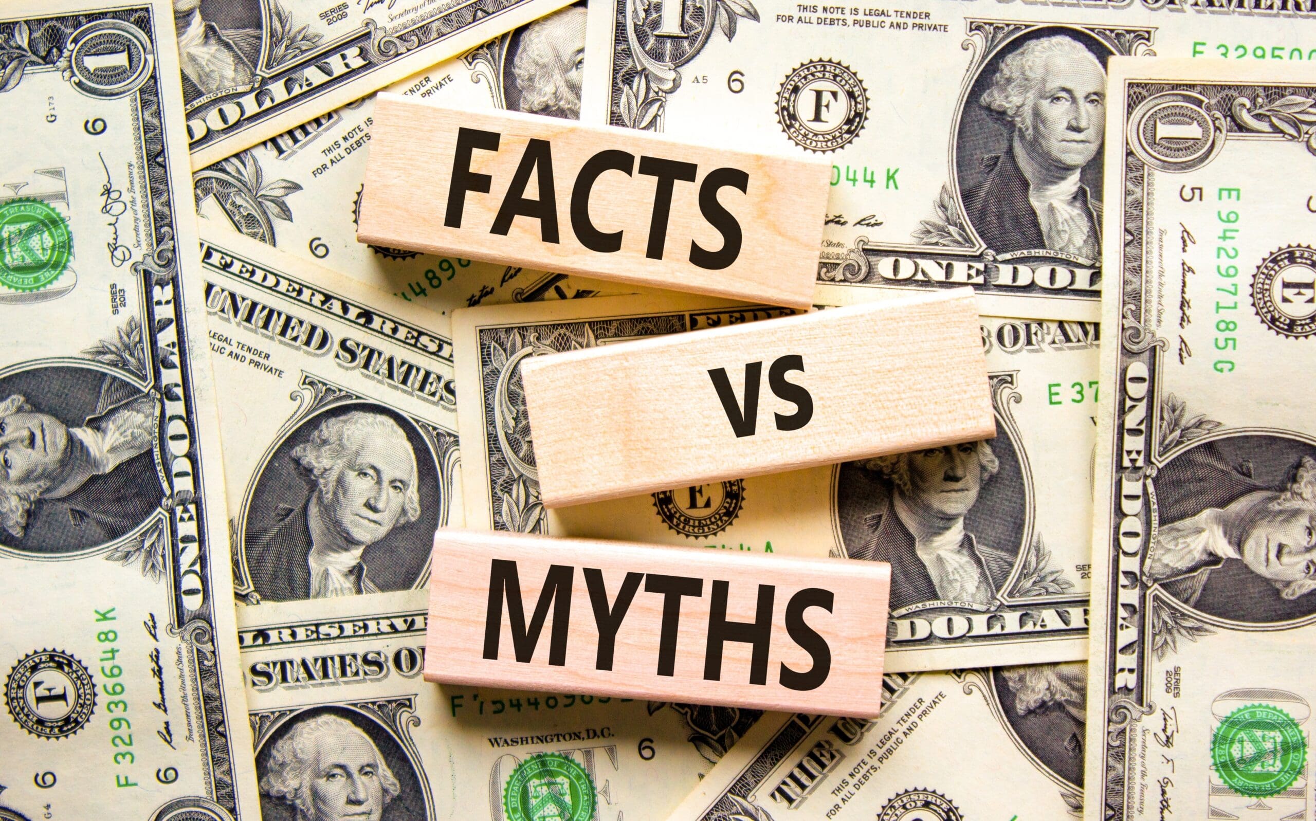Facts vs myths symbol. Concept words Facts vs myths on wooden blocks on a beautiful background from dollar bills.