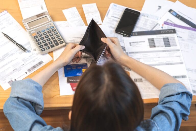 woman holding and open empty wallet, purse no have money for bill payment, credit card loan or expense.